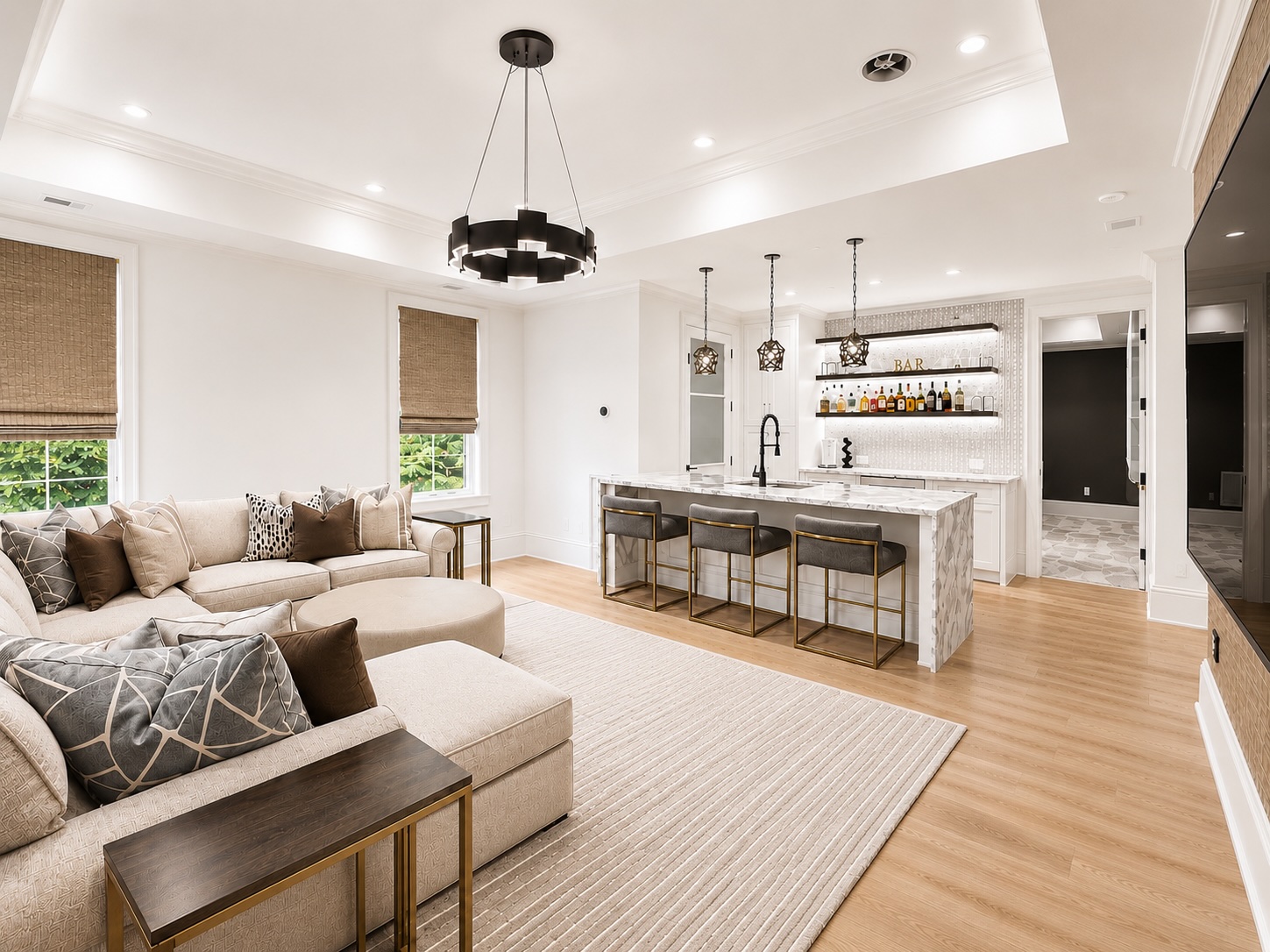 Lower-level recreation room with wet bar, lounge seating, and stone fireplace
