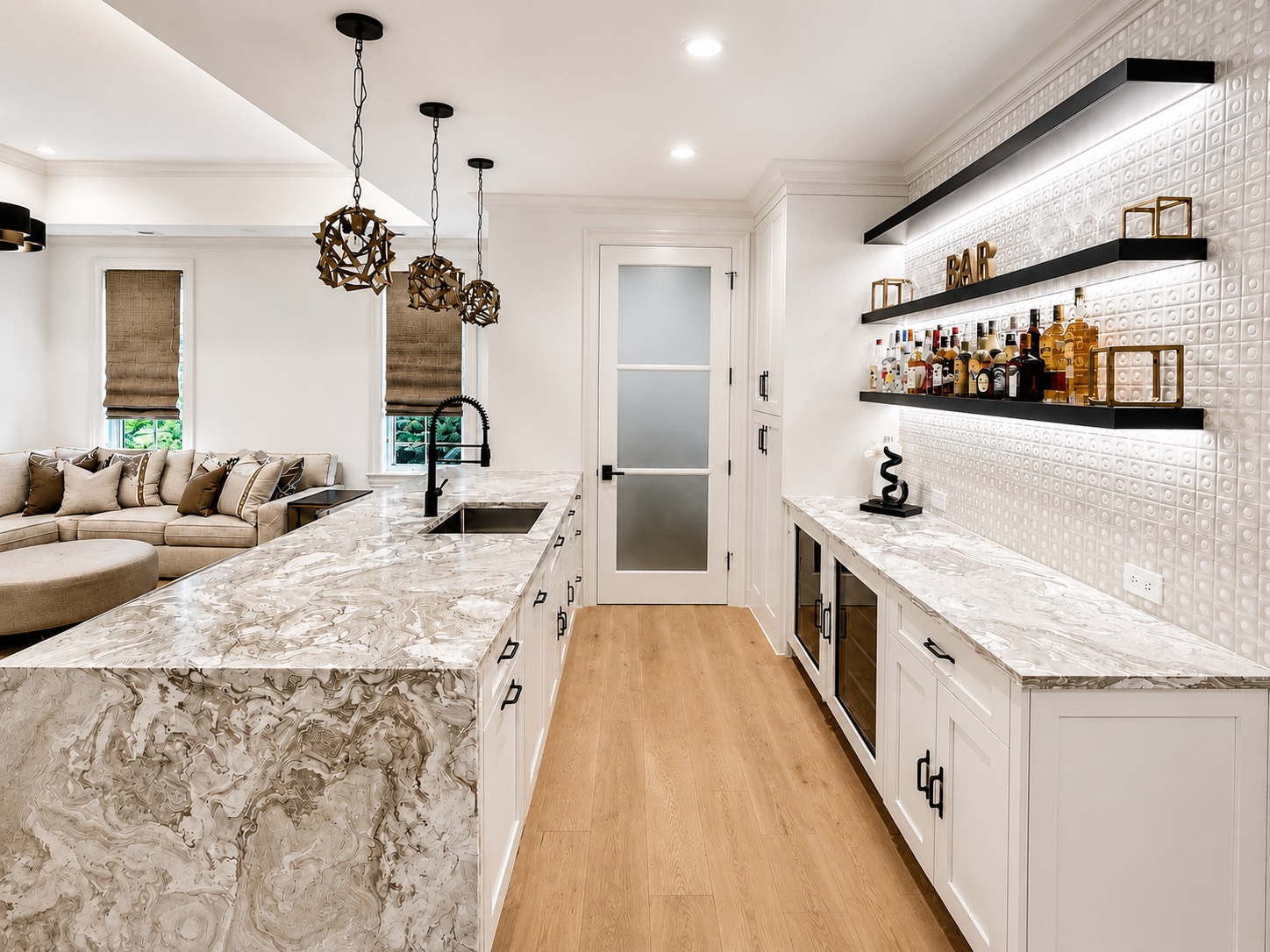 Wet bar with book-matched quartzite, floating shelves, and glass display cabinets