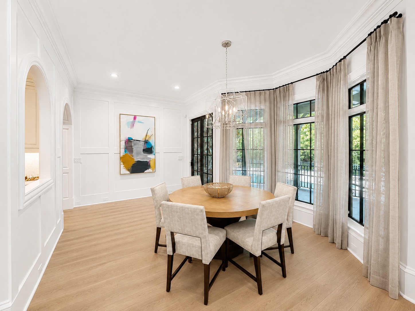 Sunlit breakfast room off the chef's kitchen with bay window