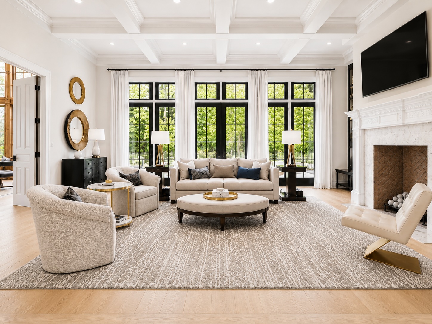 Great room with coffered ceiling, marble fireplace, and floor-to-ceiling windows to the pool