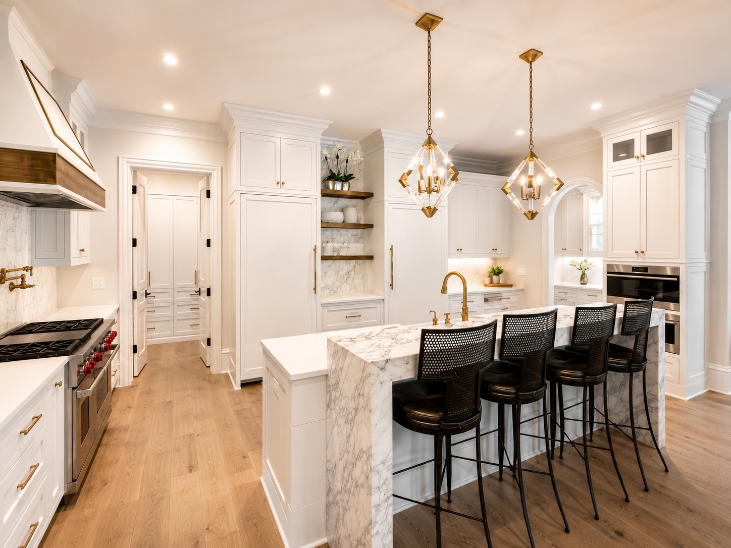 Gourmet kitchen with professional range, custom cabinetry, and butler's pantry access