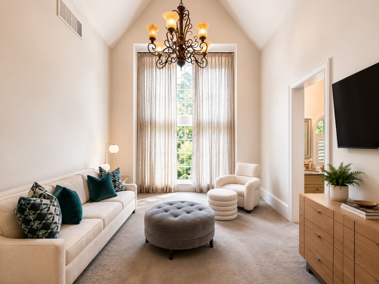 Vaulted guest bedroom with crystal chandelier and en-suite bath